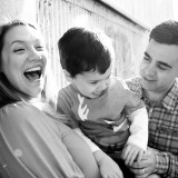 The family laughing at something obviously hilarious... probably Isaac.